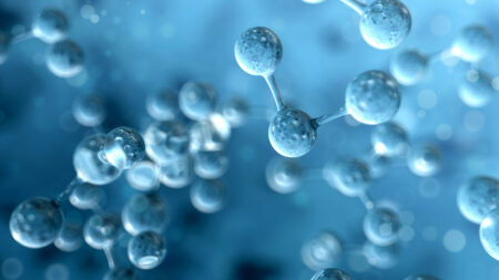 Molecule (atom) structure on blue background. Science concept