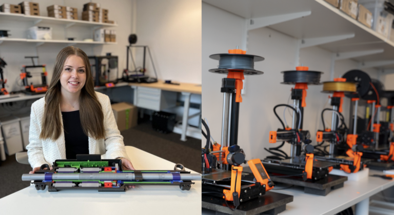 Thea shows off a prototype of Chassis Autonomy's product that they 3D printed in our Makerspace.