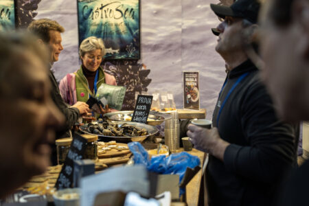 Picture from the Nordic Seafood Summit 2024. People are talking in a booth.